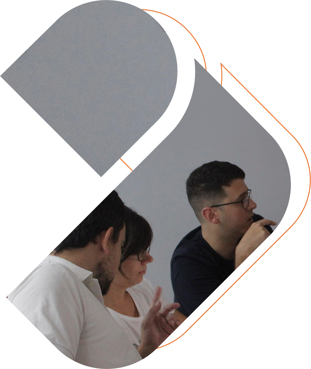 3 people from UX/UI team in a meeting reviewing a prototype in a notebook